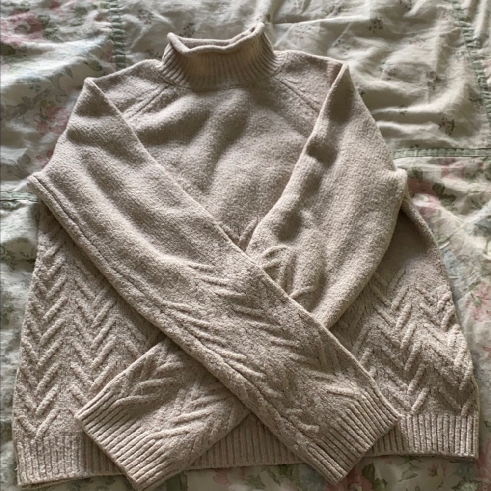 A kids turtle neck sweater.